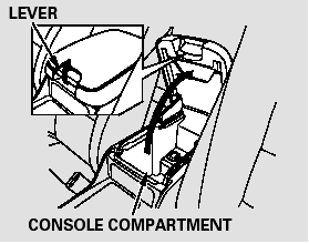 To open the console compartment,