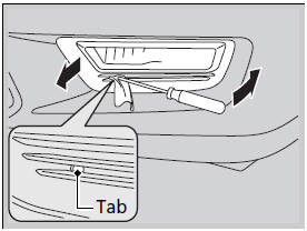 2. Insert a flat-tip screwdriver into the tab on