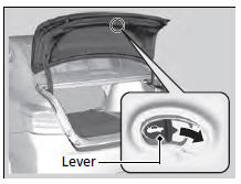 Slide the release lever in the direction of the