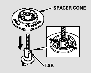 17. Remove the spacer cone from the