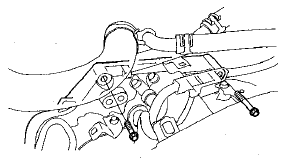 65. Lower the transmission by loosening the wing nut on