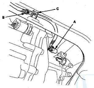 22. Disconnect the vacuum hose (A).