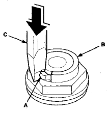 11. Remove the mainshaft holder from the mainshaft.