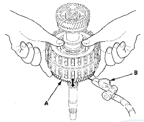 7. Measure the 5th gear axial clearance in at least three