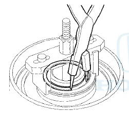10. Remove the clutch spring compressor.