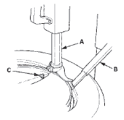 6. Remove the valve stem nut (A) and the washer (B),