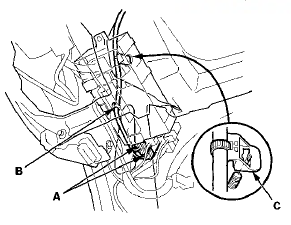 12. From under the passenger's dash, disconnect and