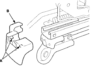 6. Slide the front seat frame forward fully, detach the