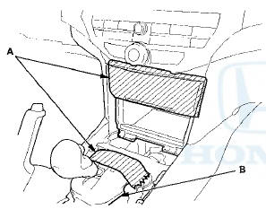 4. Open the lid, and remove the bolts securing the center