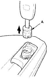 4. Reinstall the end of the retainer (A) in its slot, then