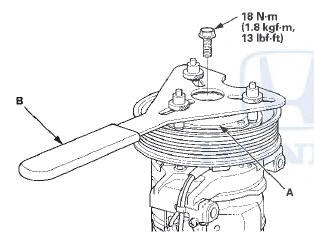 2. Remove the pressure plate (A) and the shim(s) (B),