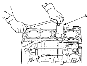 17. Use the wooden handle of a hammer (A) to drive out