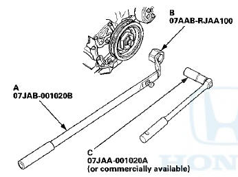 5. Remove the bolt with a socket, 19 mm (C) and a