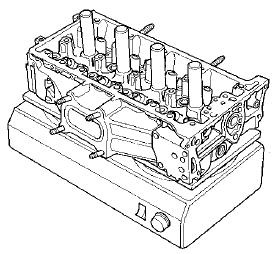 5. Working from the camshaft side, use the driver and an