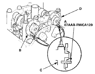 4. To hold the exhaust camshaft, insert a camshaft lock