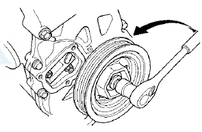3. Align the holes on the lock (A) and the auto-tensioner