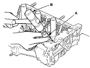 4. Install the valve spring compressor attachment and