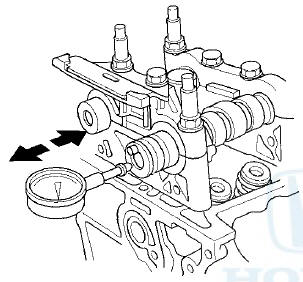 7. Loosen the camshaft holder bolts two turns at a time,