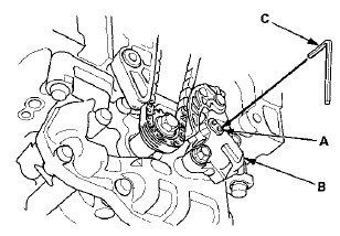 10. Loosen the oil pump sprocket mounting bolt (A).