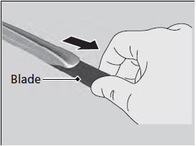 3. Slide the wiper blade out from its holder by
