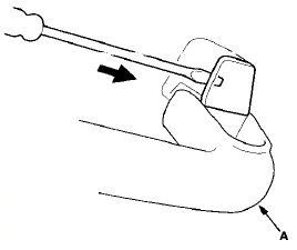 2. Pull on the small flat-tip screwdriver with the