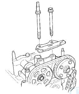 18. Remove cam chain guide A and the tensioner arm (B).